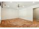 The bedroom features a ceiling fan, neutral walls, and wall-to-wall carpeting at 441 Wildlife Club Ln, Taylorsville, NC 28681