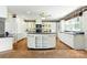 Spacious kitchen featuring a large island, black countertops and stainless steel appliances at 441 Wildlife Club Ln, Taylorsville, NC 28681