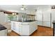 Bright kitchen featuring a large island with black countertops and stainless steel appliances at 441 Wildlife Club Ln, Taylorsville, NC 28681