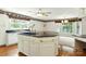 Bright kitchen featuring a large island with black countertops and stainless steel appliances at 441 Wildlife Club Ln, Taylorsville, NC 28681