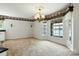The living room features lots of natural light, carpeted floor and ornate sconces at 441 Wildlife Club Ln, Taylorsville, NC 28681