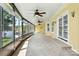 Spacious sunroom featuring an abundance of windows, ceiling fans, and carpet flooring at 441 Wildlife Club Ln, Taylorsville, NC 28681