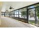 Enclosed sunroom with many windows offering stunning views of the surrounding lake at 441 Wildlife Club Ln, Taylorsville, NC 28681
