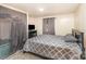 Comfortable bedroom with a gray patterned quilt, offering a relaxing retreat at 5239 Lineberger Rd, Stanley, NC 28164