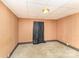 A simple empty room with wood paneling walls and carpet, perfect for customization at 5239 Lineberger Rd, Stanley, NC 28164