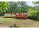 Charming single-story home featuring a wooden deck and lush green lawn at 5239 Lineberger Rd, Stanley, NC 28164