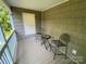 Relaxing covered back porch with seating, perfect for enjoying the outdoors at 5570 George Henry Dr, Hickory, NC 28602