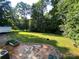 Expansive backyard with mature trees and green space, perfect for outdoor activities at 5570 George Henry Dr, Hickory, NC 28602