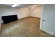 Spacious basement with vinyl floors, overhead lighting, and access to a door at 5570 George Henry Dr, Hickory, NC 28602