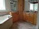 Relaxing bathroom featuring a corner tub and double sinks at 5570 George Henry Dr, Hickory, NC 28602
