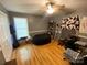 Bedroom with hardwood floors, large window, and lots of natural light at 5570 George Henry Dr, Hickory, NC 28602
