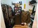 Walk in closet with gun safe, clothing, and storage shelves at 5570 George Henry Dr, Hickory, NC 28602