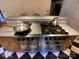 Close-up of modern kitchen appliances, featuring a professional gas range at 5570 George Henry Dr, Hickory, NC 28602
