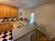 Kitchen featuring a breakfast bar, stainless steel appliances and ample counter space at 5570 George Henry Dr, Hickory, NC 28602