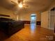 Spacious main bedroom featuring hardwood floors, adjoining bathroom, and natural light at 5570 George Henry Dr, Hickory, NC 28602