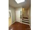 Interior entry features wood flooring, staircase, and a convenient storage area at 5570 George Henry Dr, Hickory, NC 28602
