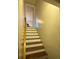 Interior staircase features wood treads and a handrail leading up to an open doorway at 5570 George Henry Dr, Hickory, NC 28602