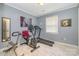 Bright exercise room featuring multiple machines and light tile floor at 5711 Lambrook Ct, Charlotte, NC 28269