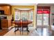 Eat in kitchen featuring a table in front of a bay window that lets in natural light and outdoor views at 5711 Lambrook Ct, Charlotte, NC 28269