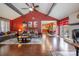 Spacious living room with hardwood floors, fireplace and an open view to the kitchen and dining area at 5711 Lambrook Ct, Charlotte, NC 28269