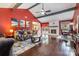 Bright living room features a fireplace, wood floors, neutral furniture and lots of natural light at 5711 Lambrook Ct, Charlotte, NC 28269