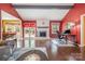 Spacious living room features wood floors, large fireplace, neutral furniture and lots of natural light at 5711 Lambrook Ct, Charlotte, NC 28269