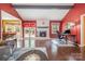 Spacious living room features wood floors, large fireplace, neutral furniture and lots of natural light at 5711 Lambrook Ct, Charlotte, NC 28269