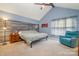 Spacious main bedroom with vaulted ceilings, wood accent wall and a large window at 5711 Lambrook Ct, Charlotte, NC 28269