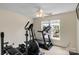 Bright exercise room with an elliptical machine, treadmill, and natural light from windows at 7800 Conifer Cir, Indian Trail, NC 28079