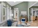 Living area features a comfortable sofa, an area rug, natural light, and access to a patio at 7800 Conifer Cir, Indian Trail, NC 28079