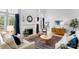 Sun-filled living room with vaulted ceilings, fireplace, and stylish decor at 7800 Conifer Cir, Indian Trail, NC 28079