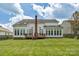 Rear view of the house showing the deck, sunroom addition, and chimney at 7800 Conifer Cir, Indian Trail, NC 28079