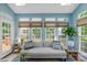 Bright sunroom with skylights, light blue walls, neutral furniture, and lots of natural light at 7800 Conifer Cir, Indian Trail, NC 28079