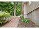 Scenic path on the side of the home, accented by greenery and shade at 816 Fulton St, Albemarle, NC 28001