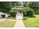 Charming home with a welcoming front porch, complemented by lush greenery at 816 Fulton St, Albemarle, NC 28001