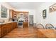 Well-lit kitchen with a mix of stainless steel appliances and wood cabinets at 816 Fulton St, Albemarle, NC 28001