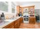 Kitchen featuring light countertops and stainless steel oven with ample storage at 816 Fulton St, Albemarle, NC 28001