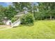 Expansive lawn and lovely landscaping surround this charming home's exterior at 816 Fulton St, Albemarle, NC 28001