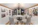 Charming home office featuring white walls, chandelier, desk, and comfortable chairs at 827 Ashwyn Dr, Charlotte, NC 28211