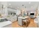 Open concept kitchen with a large island, stainless steel appliances, and views into the Gathering room at 827 Ashwyn Dr, Charlotte, NC 28211