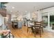 Beautiful kitchen with a center island, white cabinets, pendant lighting, and adjacent dining area at 827 Ashwyn Dr, Charlotte, NC 28211