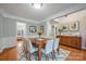 Traditional dining room featuring wood table, decorative rug, and natural light at 8805 Deerland Ct, Huntersville, NC 28078