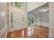 Bright foyer with hardwood floors and a grand entrance, enhanced by large windows and natural light at 8805 Deerland Ct, Huntersville, NC 28078
