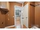 Hallway view into kitchen showcasing granite countertops, wood floors and stainless appliances at 8805 Deerland Ct, Huntersville, NC 28078