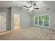Spacious main bedroom featuring vaulted ceilings, neutral carpet, ensuite bathroom, and lots of light at 8805 Deerland Ct, Huntersville, NC 28078