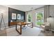 Bright office space with large desk, neutral tones, and natural light from windows at 8805 Deerland Ct, Huntersville, NC 28078