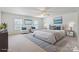 Bright bedroom filled with natural light, comfortable furniture, neutral carpet and coastal-themed decor at 8915 Merrie Rose Ave, Charlotte, NC 28213