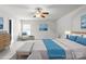 Relaxing primary bedroom with light-colored decor, warm lighting and ample open space at 8915 Merrie Rose Ave, Charlotte, NC 28213