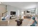 Spacious open-concept living area connects to the dining room with hardwood floors, and modern decor at 8915 Merrie Rose Ave, Charlotte, NC 28213