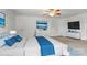 Bright main bedroom with a ceiling fan, dresser and attached Primary bath at 8915 Merrie Rose Ave, Charlotte, NC 28213